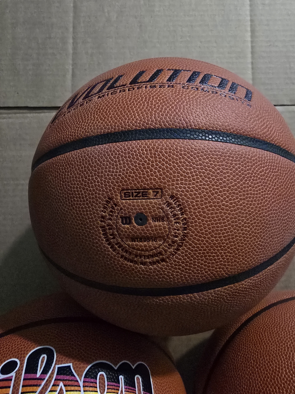 Wilson Orange Basketball with Black Ribbing